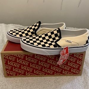 Black and white slip on vans